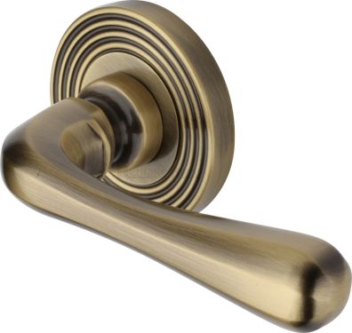 Click Here To Enlarge This Photo Of RR3022-AT Heritage Brass Door Handle Lever Latch on Round Rose Charlbury Reeded Design Antique Brass finish