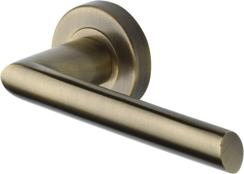 Click Here To Enlarge This Photo Of V3262-AT Heritage Brass Door Handle Lever Latch on Round Rose Mercury Design Antique Brass finish