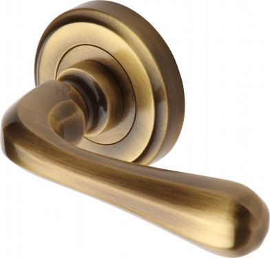Click Here To Enlarge This Photo Of V3020-AT Heritage Brass Door Handle Lever Latch on Round Rose Charlbury Design Antique Brass Finish